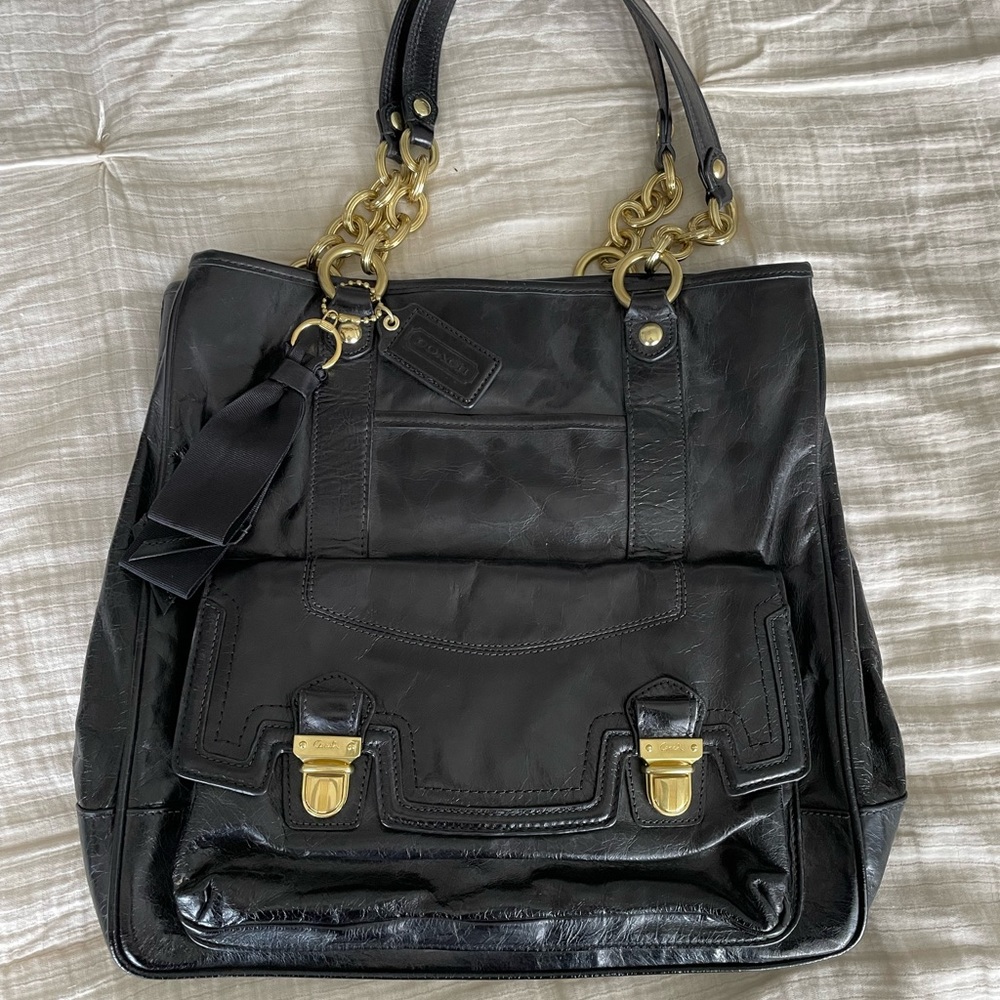 New, never worn or used Coach Carryall. Black leather with hot pink interior